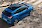 Kékszínű Ford Puma útkereszteződéshez érkezik