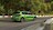 Zöld Ford Focus halad a versenypályán