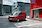 Ford Transit Courier modell áll a piros épület előtt