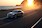 Ford Mustang Mach-E tengerparti úton halad a naplementében